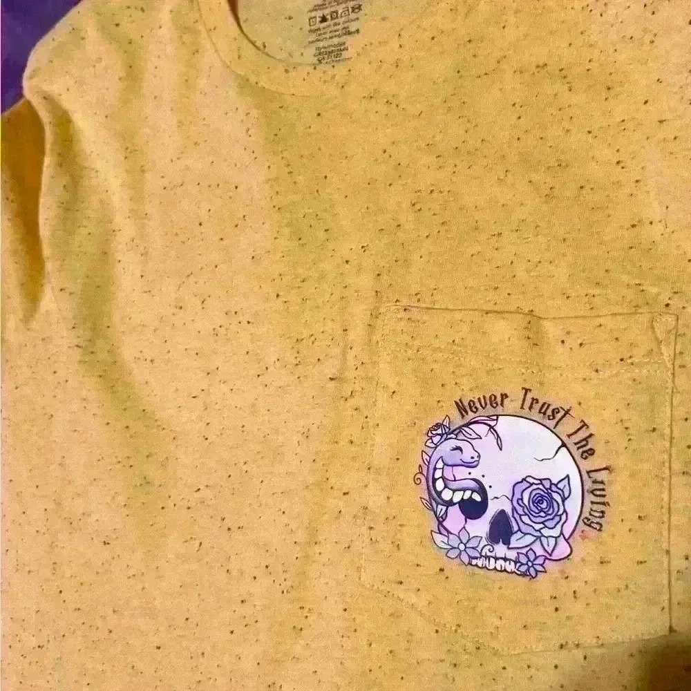 “Never trust the living” yellow Tshirt  with pocket size medium